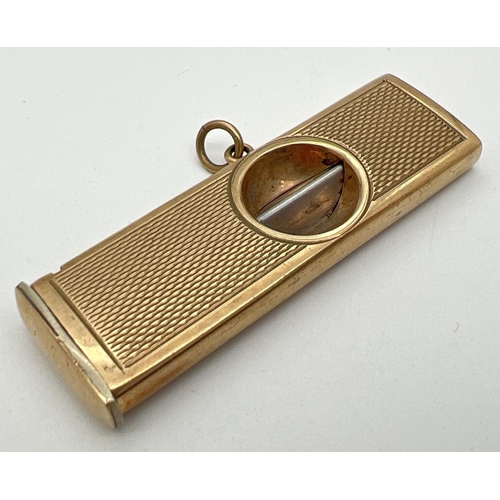 1133 - A vintage 9ct gold cigar cutter with engine turned decoration to both sides and central hanging bale... 