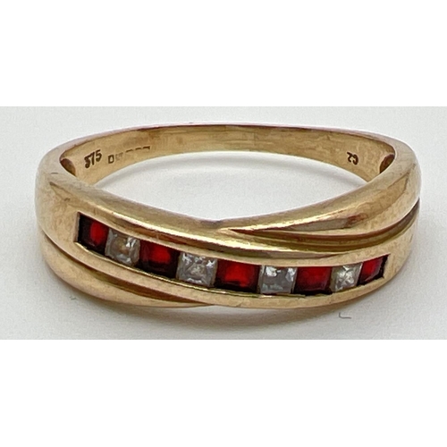 1035 - A 9ct gold crossover design channel set garnet and cubic zirconia eternity ring. Set with 5 square c... 