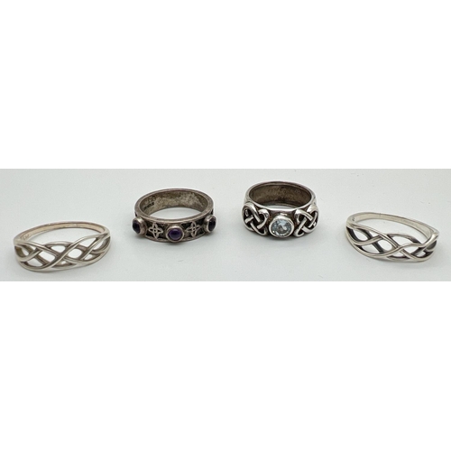 1039 - 4 silver Celtic design band style rings. One set with a single round cut blue topaz and another set ... 