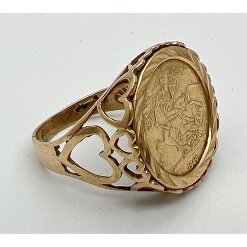 1046 - A 9ct gold St. George medallion signet ring with pierced heart decoration to both shoulders and moun... 