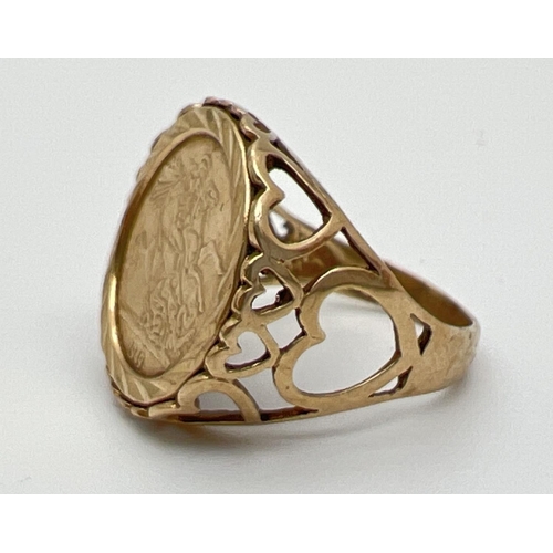 1046 - A 9ct gold St. George medallion signet ring with pierced heart decoration to both shoulders and moun... 