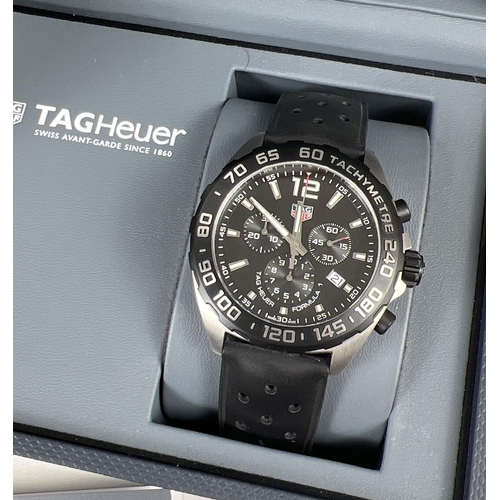 1121 - A boxed TAGHeuer Caz 1010 WME7172 Mens tachymeter chronograph wristwatch with black silicone strap. ... 