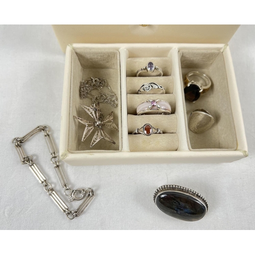 1057 - A small modern cream faux leather jewellery box with lift out tray containing a collection of silver... 