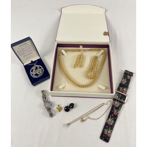 1050 - A small collection of costume jewellery and watches. To include a boxed 'Inspirations' necklace, bra... 