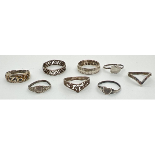 1054 - 8 silver and white metal rings, mostly band style. To include Mizpah, wishbone and heart shaped sign... 