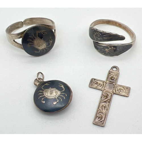 1055 - 4 pieces of silver jewellery. A Siam silver ring and matching pendant with crab decoration, a double... 