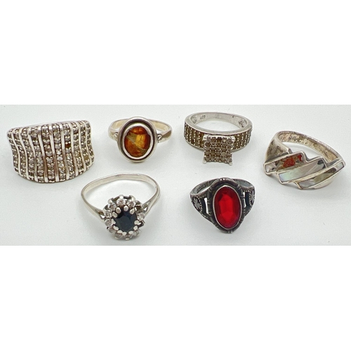 1059 - 6 silver dress rings, all stone set. In varying sizes and conditions. To include sapphire, garnet an... 