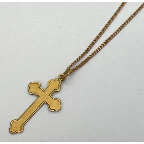 1062 - A vintage 9ct gold cross pendant on an 18