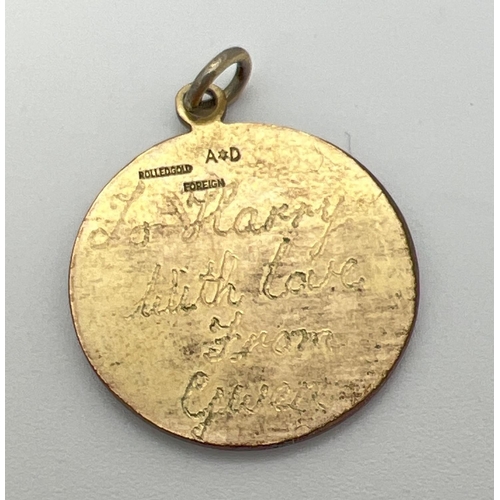 1065 - A scrap gold fine belcher chain together with a rolled gold St. Christopher pendant with engrave mes... 