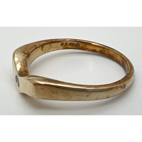 1077 - A 9ct gold wishbone ring. Full hallmarks to inside of band. Size M. Total weight approx. 2.5g.