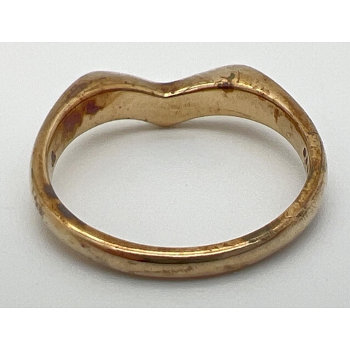 1077 - A 9ct gold wishbone ring. Full hallmarks to inside of band. Size M. Total weight approx. 2.5g.