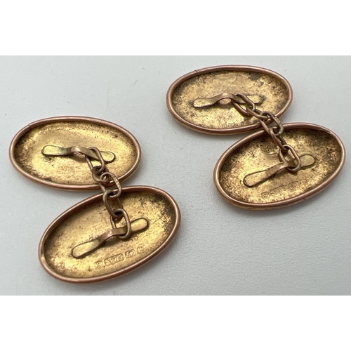 1084 - A pair of vintage 9ct gold oval shaped chain link cufflinks with floral design engraved panels. Full... 