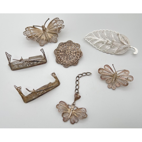 1008 - A small collection of vintage silver filigree jewellery items, all with silver number marks to rever... 