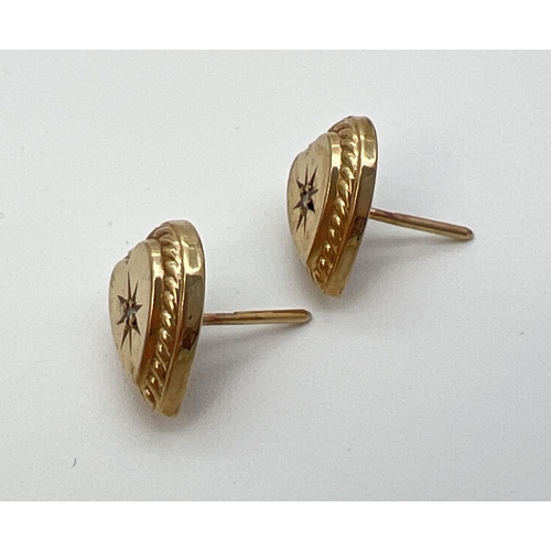 1090 - A pair of vintage 9ct gold heart shaped stud earrings each set with a central small round cut diamon... 