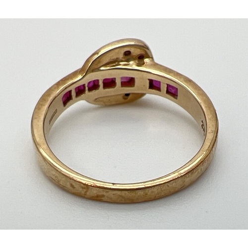 1001 - A 9ct gold ruby and diamond set buckle style dress ring. Band channel set with 5 square cut rubies. ... 