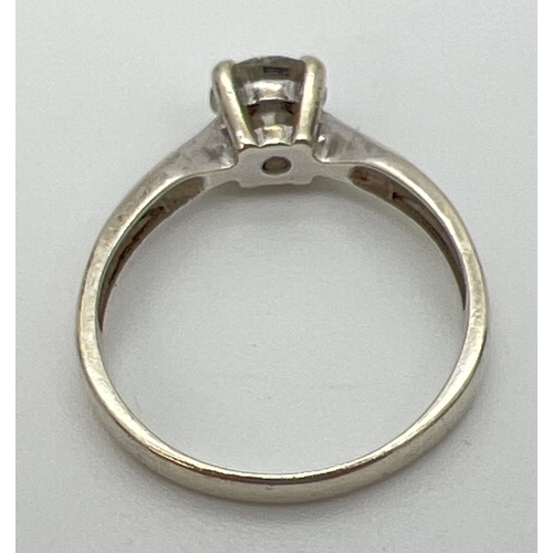 1091 - A 9ct white gold .75ct moissanite solitaire engagement/dress ring. Full hallmarks to inside of band.... 