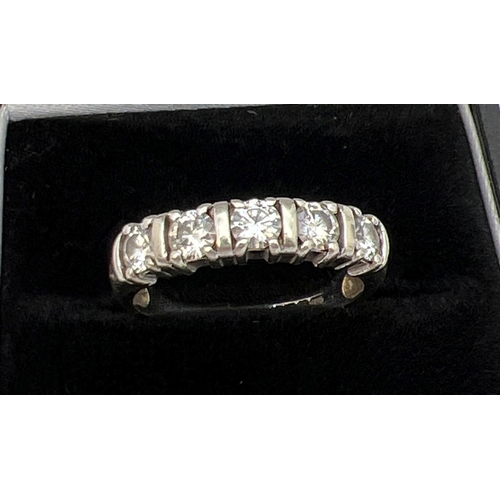 1092 - A 9ct white gold half eternity ring set with 5 .20 ct round cut moissanite stones, total 1ct. Full h... 