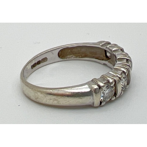 1092 - A 9ct white gold half eternity ring set with 5 .20 ct round cut moissanite stones, total 1ct. Full h... 