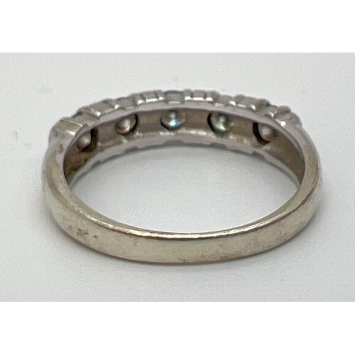 1092 - A 9ct white gold half eternity ring set with 5 .20 ct round cut moissanite stones, total 1ct. Full h... 