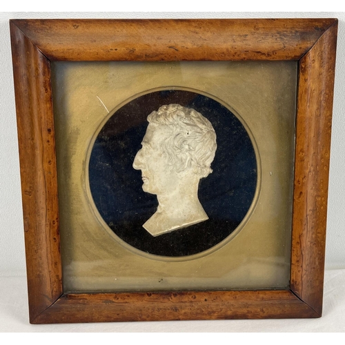 1308 - An antique framed and glazed plaster bust of The Duke of Wellington. Frame size approx. 24 x 23cm.