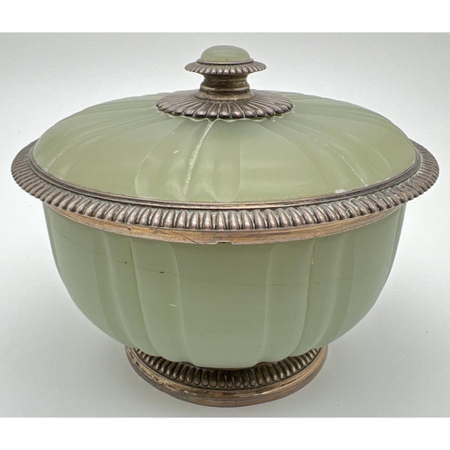 1139 - A late Victorian French green opaline glass lidded bowl with silver mount, circa 1900. Gilt to insid...