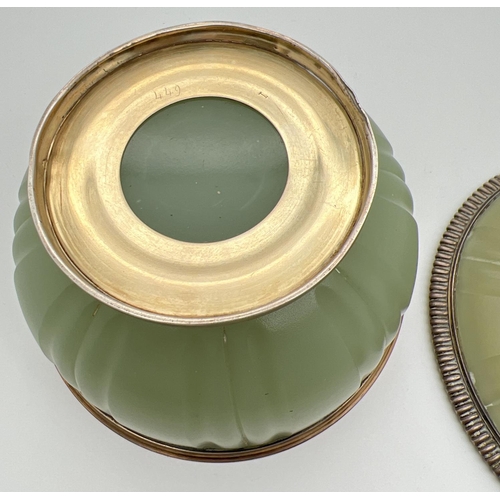 1139 - A late Victorian French green opaline glass lidded bowl with silver mount, circa 1900. Gilt to insid... 