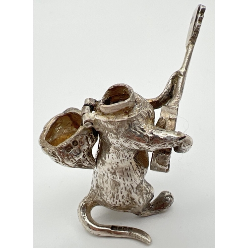 1145 - An Edwardian silver novelty container modelled as a cat playing a banjo, with hinged head. Import ha... 