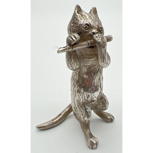 1146 - An Edwardian silver novelty container modelled as a cat playing the flute, with hinged head. Import ... 