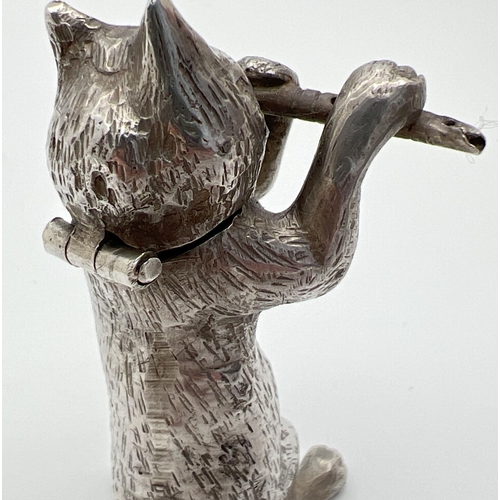 1146 - An Edwardian silver novelty container modelled as a cat playing the flute, with hinged head. Import ... 