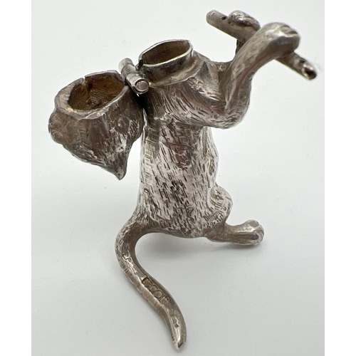 1146 - An Edwardian silver novelty container modelled as a cat playing the flute, with hinged head. Import ... 