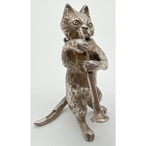 1147 - An Edwardian silver novelty container modelled as a cat playing the clarinet, with hinged head. Impo... 