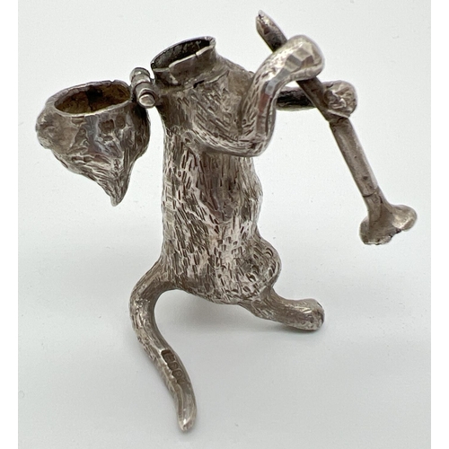 1147 - An Edwardian silver novelty container modelled as a cat playing the clarinet, with hinged head. Impo... 