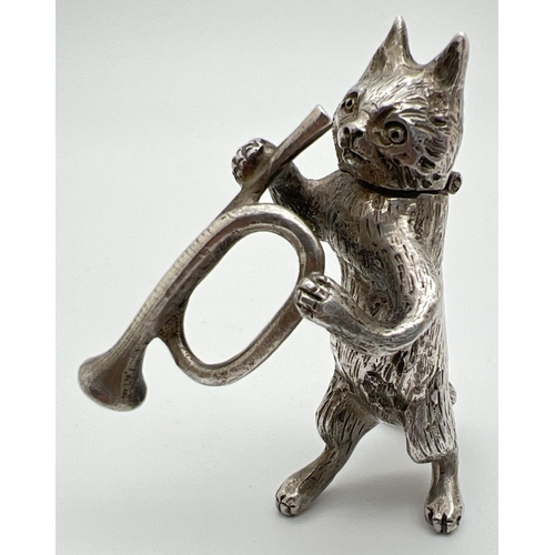 1148 - An Edwardian silver novelty container modelled as a cat playing the bugle, with hinged head. Import ... 