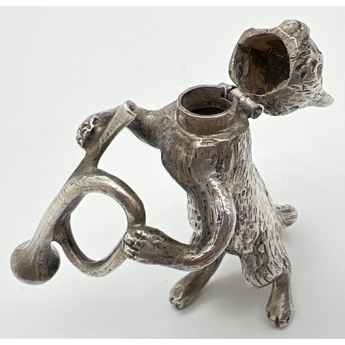 1148 - An Edwardian silver novelty container modelled as a cat playing the bugle, with hinged head. Import ... 