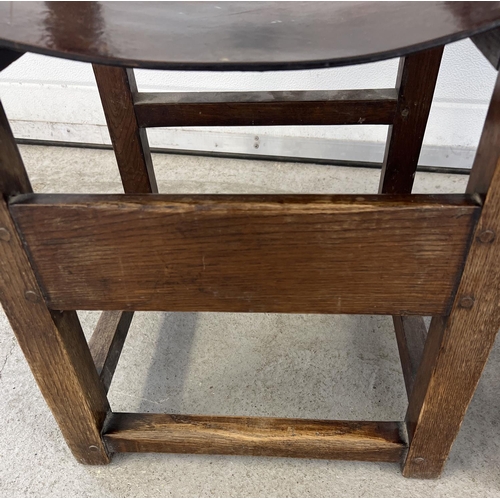 1340 - 2 dark oak Arts & Crafts style wooden block chairs with leather backs and seats. Large brass stud de... 