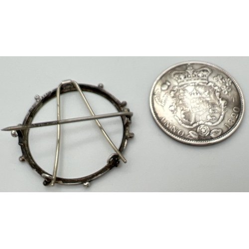 6 - A George IIII silver half crown, dated 1820, in a Victorian silver brooch mount. Crown shield of arm... 