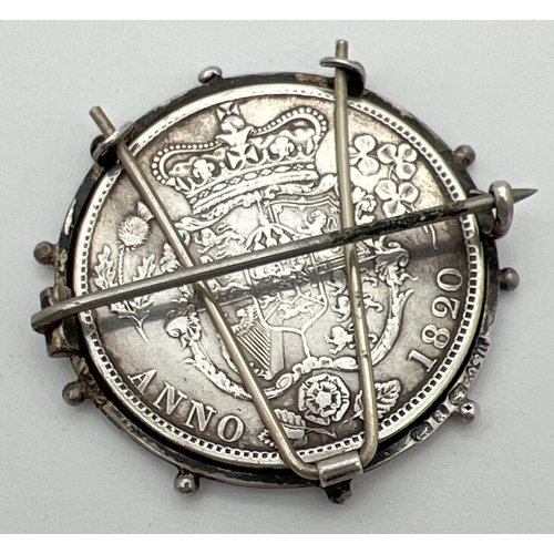 6 - A George IIII silver half crown, dated 1820, in a Victorian silver brooch mount. Crown shield of arm... 