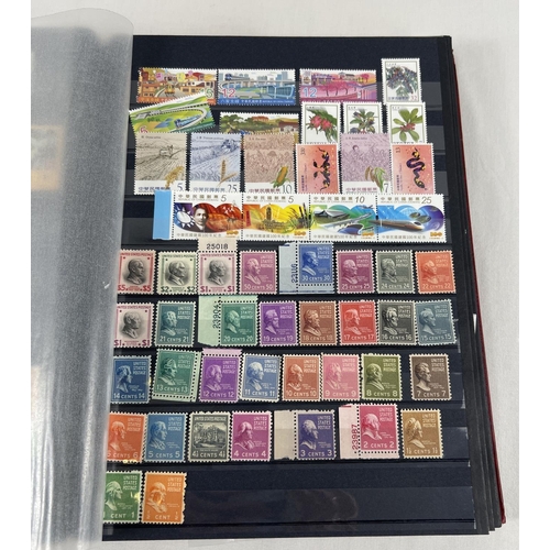 79 - A red stamp album containing a collection of world stamps mostly in mint condition. To include examp... 