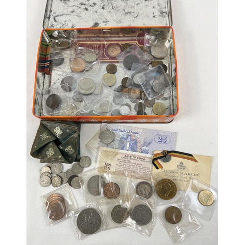 62 - A tin containing a collection of British and foreign vintage coins and bank notes. To include exampl... 