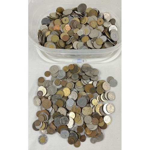 63 - A tub of vintage British and foreign coins. To include examples from France, Malta, Austria, Barbado... 