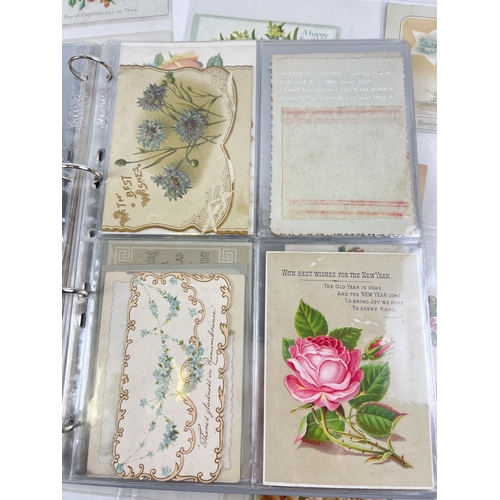 162 - An album containing 88 assorted Victorian & Edwardian greetings cards. In varying styles, sizes and ... 