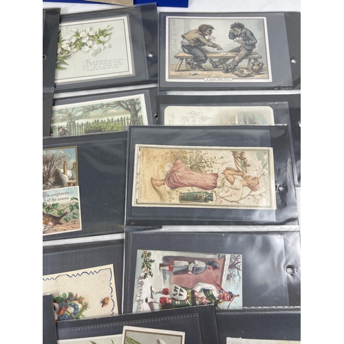 166 - An album containing 83 assorted Victorian & Edwardian greetings cards. In carded plastic wallets.