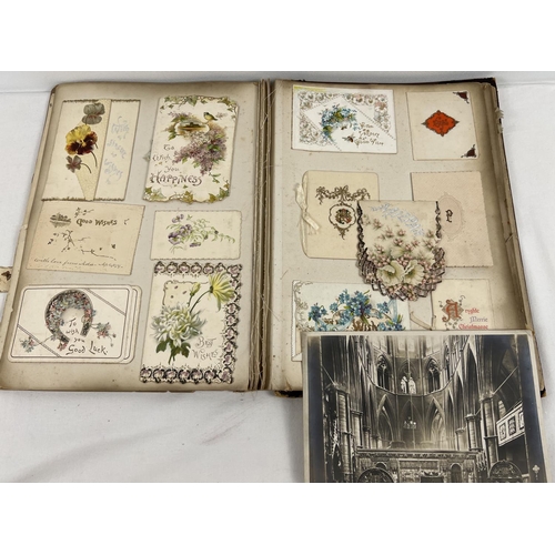 173 - 2 Victorian/Edwardian scraps albums (a/f). Red album containing assorted scraps, prints and greeting... 