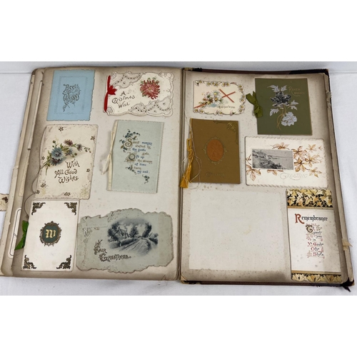 173 - 2 Victorian/Edwardian scraps albums (a/f). Red album containing assorted scraps, prints and greeting... 