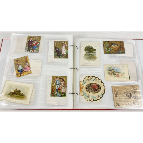 179 - A large red album containing 312 assorted Victorian & Edwardian greetings cards. In varying shapes, ... 