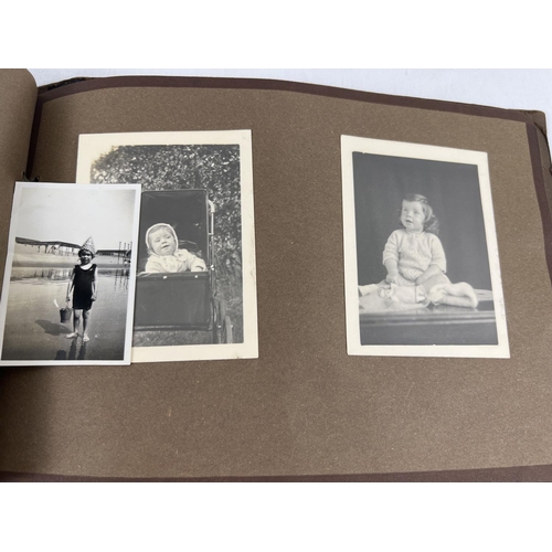 193 - 4 assorted vintage 1930's photograph albums containing a quantity of assorted black & white photos.