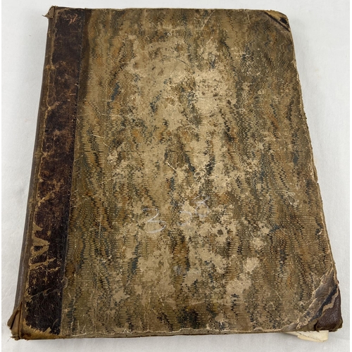 194 - A large Victorian scrap book containing a quantity of scraps, etchings and prints.