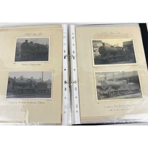 196 - 2 albums of vintage black and white photographs of steam trains.