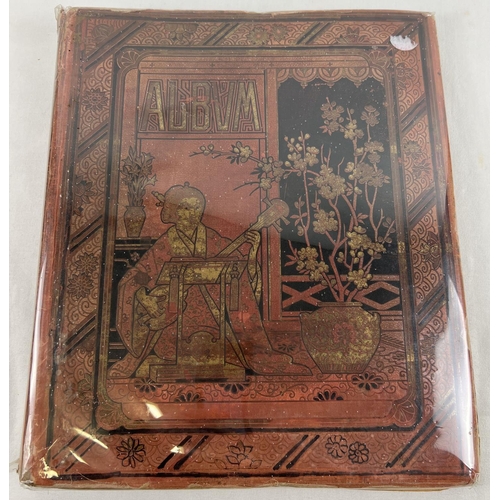 202 - A Victorian large red scraps album with cover decorated in an Oriental design with gilt detail.