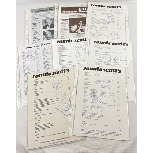 211 - A collection of autographed Ronnie Scott's Jazz Club programmes and menu cards. Dating from the 1980... 